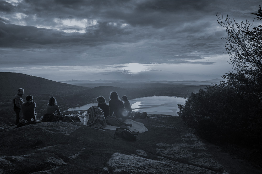 hiker friends watching sunset