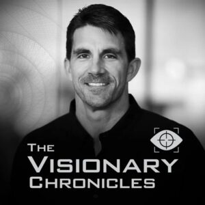 Sharp black-and-white portrait and branding reading 'The Visionary Chronicles' with an eye icon